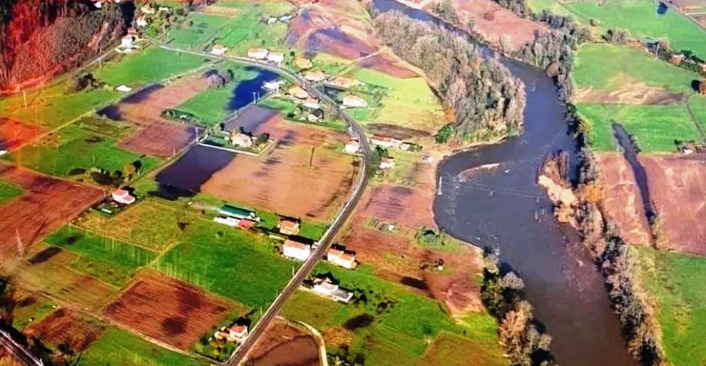 Zona afectada por las inundaciones en el río Pas, en la localidad de Vioño, en Piélagos.